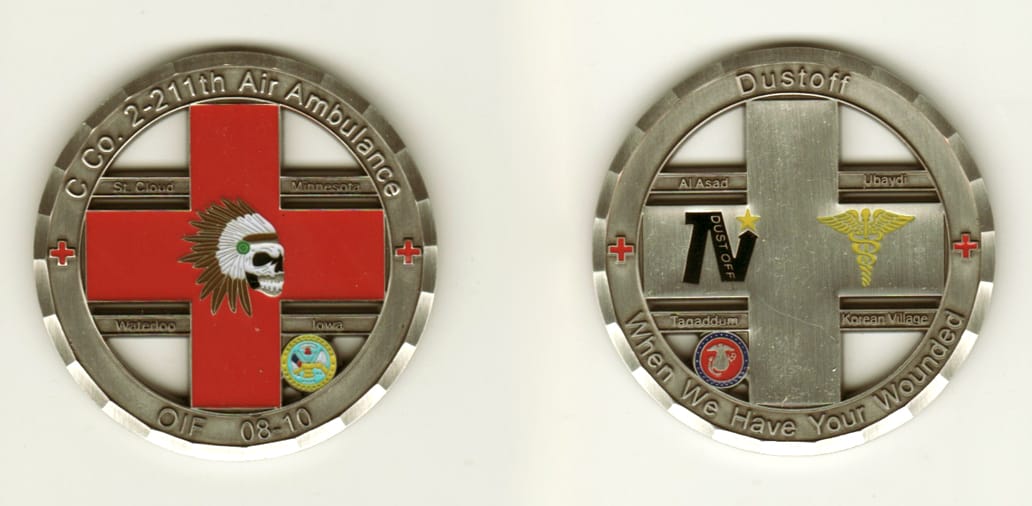 Round shaped, pewter colored coin, 2 1/8 inches in diameter.