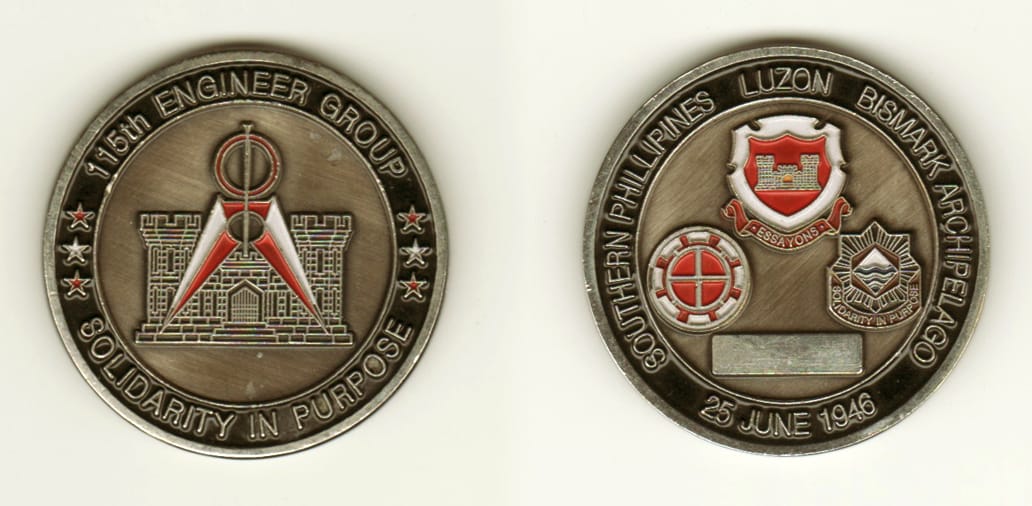 Round shaped, pewter colored coin, 1 13/16 inches in diameter.