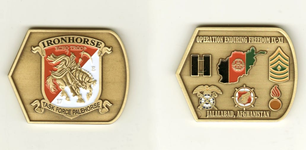 Retangluar shaped with one side bowed out with the opposite side pointed out , brass colored coin, 1 1/2 inches high x 2...