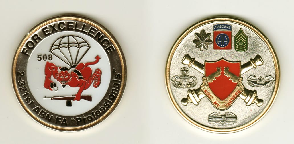 Round shaped, gold colored coin, 2 1/8 inches in diameter.