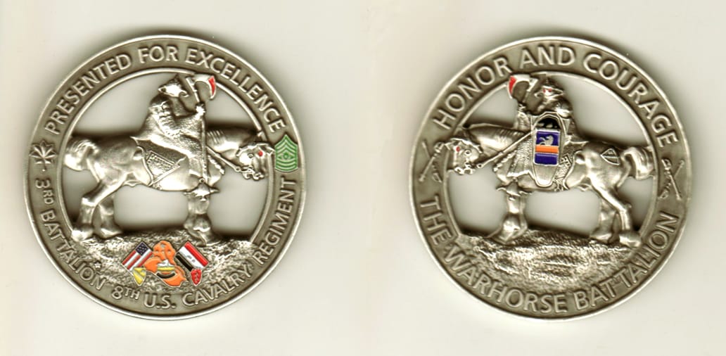 Round shaped, pewter colored coin, 2 1/8 inches in diameter.