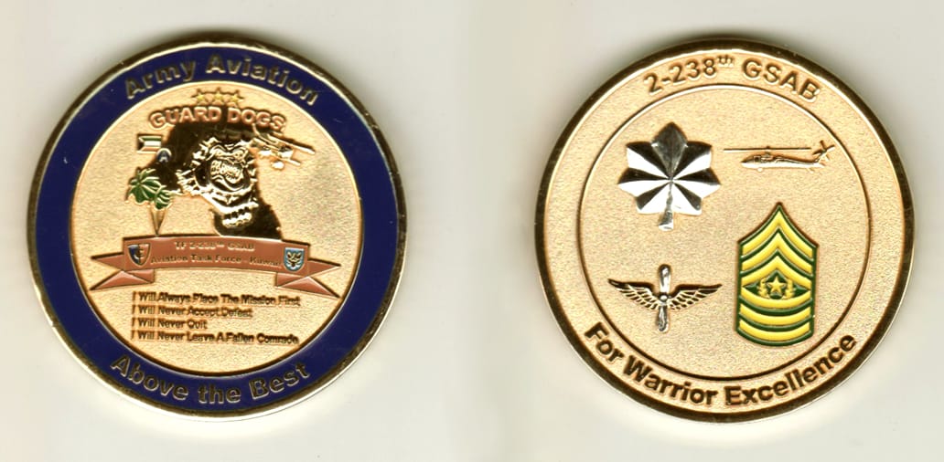 Round shaped, gold colored coin, 2 1/8 inches in diameter.