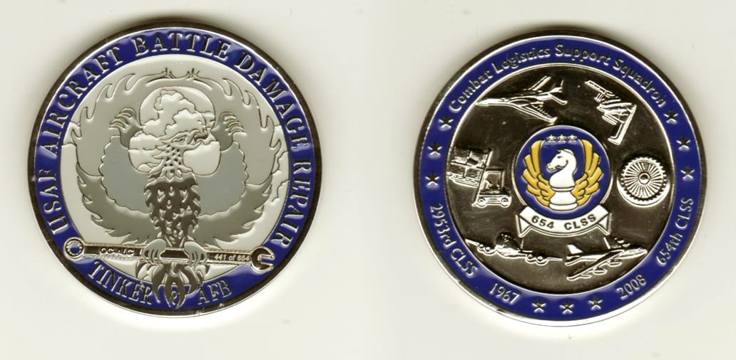 Round shaped, silver colored coin, 2 1/8 inches in diameter.