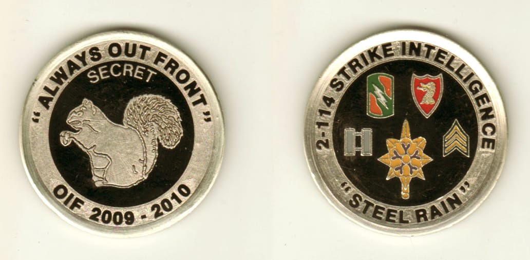 Round shaped, pewter colored coin, 1 3/4 inches in diameter.