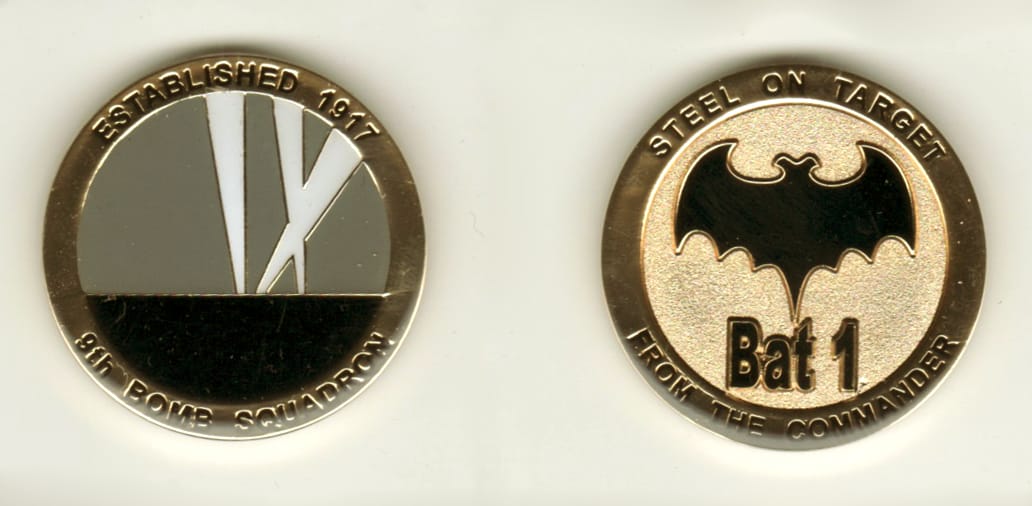 Round shaped, gold colored coin, 1 1/2 inches in diameter.