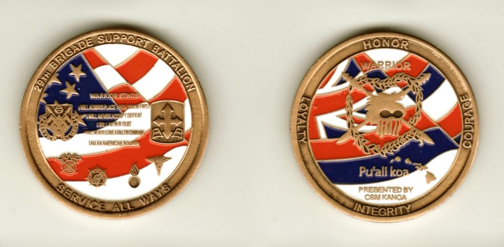 Round shaped, brass colored coin, 1 1/4 inches in diameter.