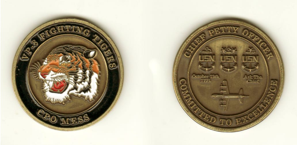 Round shaped, brass colored coin, 1 1/4 inches in diameter.