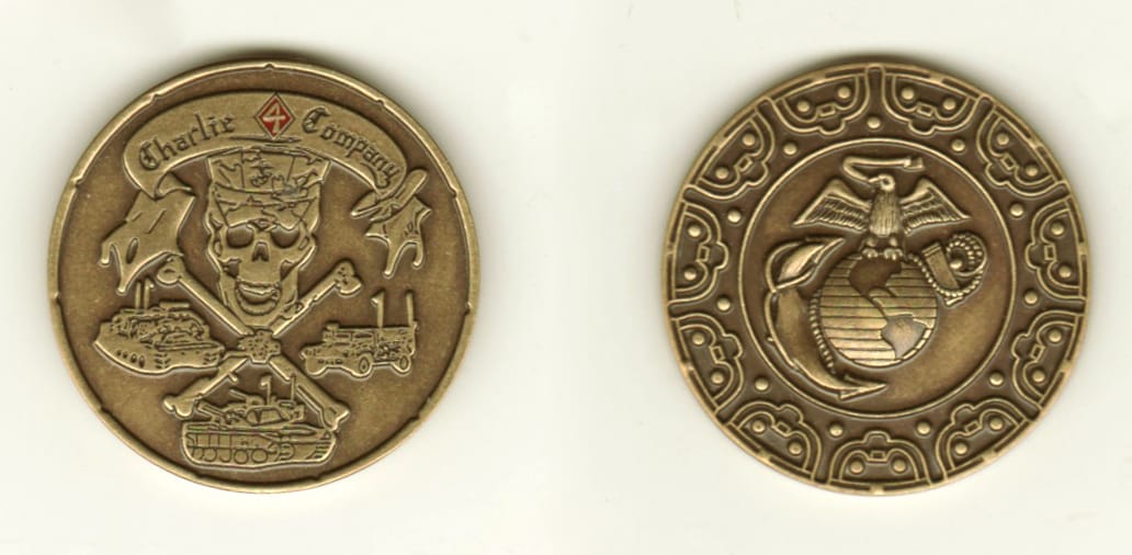 Round shaped, brass colored coin, 1 1/4 inches in diameter.