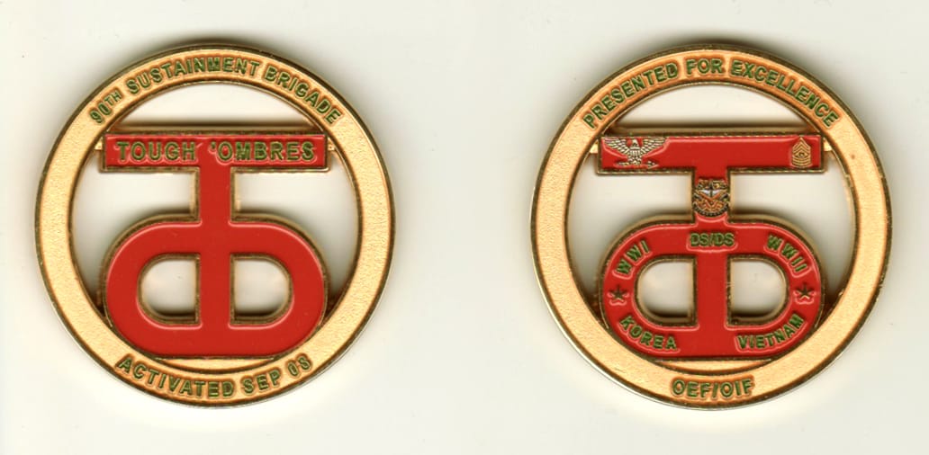 Round shaped, gold colored coin, 1 11/16 inches in diameter.