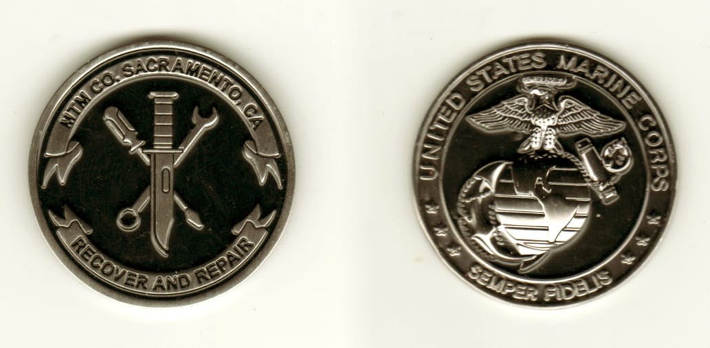 Round shaped, siklver colored coin, 1 13/16 inches in diameter.