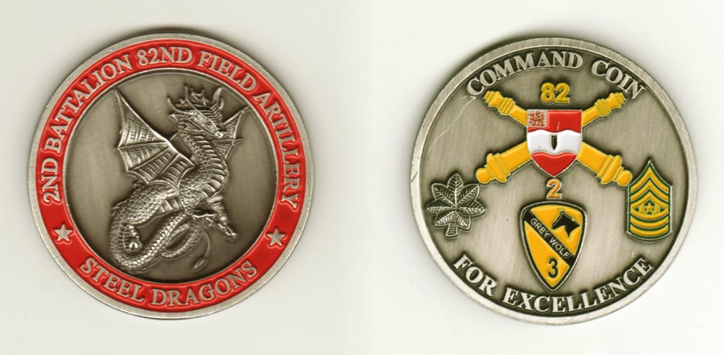 Round shaped, pewter colored coin, 2-1/8 inches in diameter.