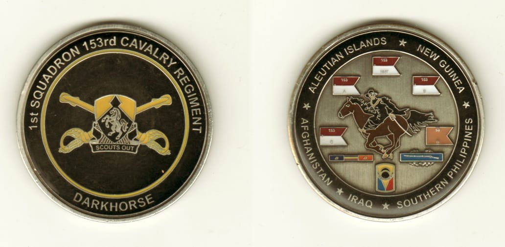 Round shaped, pewter colored coin, 2 1/8 inches in diameter.