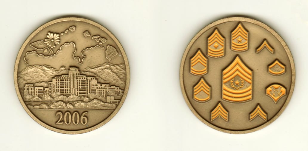 Round shaped, brass colored coin, 2 1/8 inches in diameter.