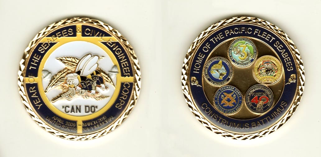 Round shaped, gold colored coin, 2 inches in diameter.