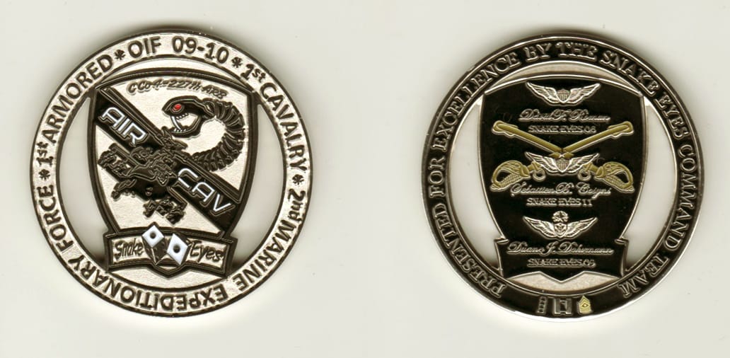 Round shaped, silver colored coin, 2 inches in diameter.