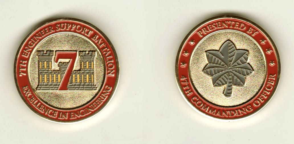 Round shaped, gold colored coin, 1 3/8 inches in diameter.