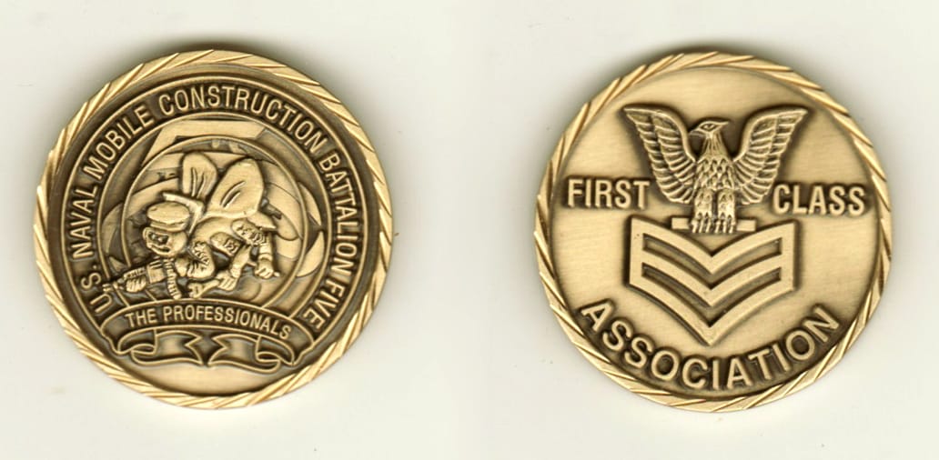 Round shaped, brass colored coin, 1 1/4 inches in diameter.