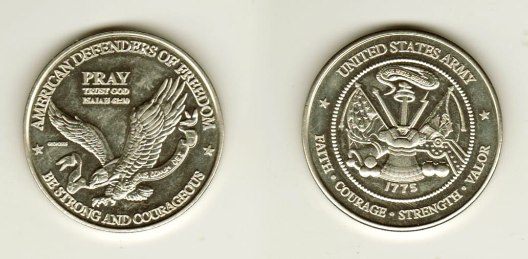 Round shaped, silver colored coin, 1 1/2 inches in diameter.