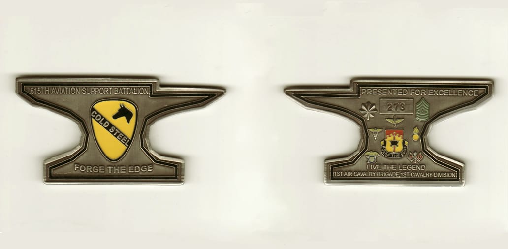 Anvil shaped, pewter colored coin, 3 1/2 inches wide x1 3/4  inches high.