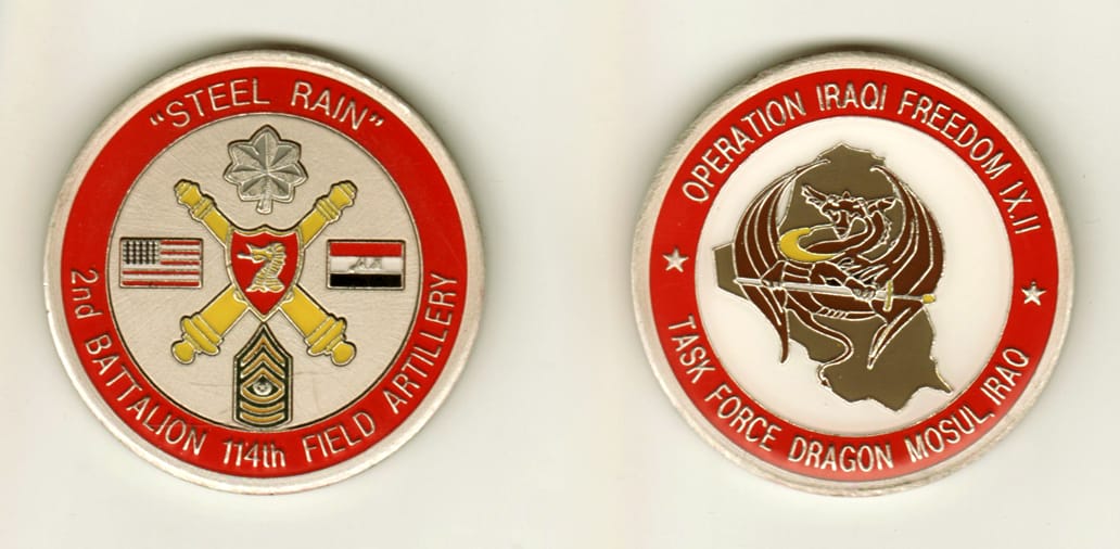 Round shaped, pewter colored coin, 2 inches in diameter.