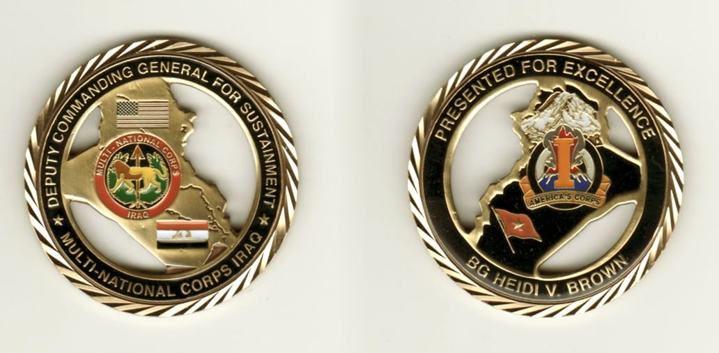 Round shaped, brass colored coin, 2 inches in diameter.