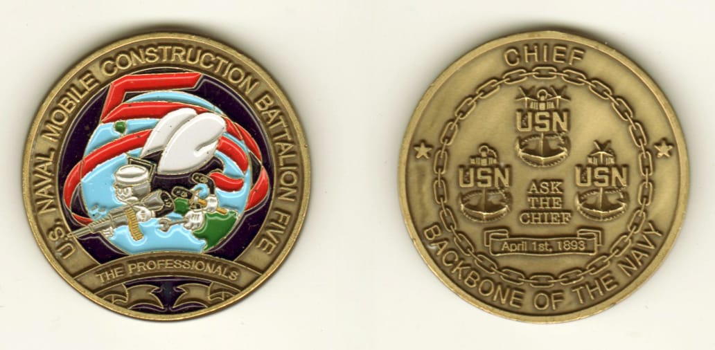 Round shaped, brass colored coin, 1 13/16 inches in diameter.