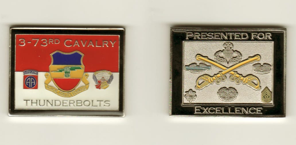 Retangular shaped, silver colored coin, 2 3/4 inches high x 2-1/4 inches wide.