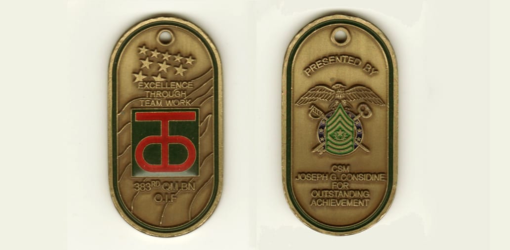 Dog Tag shapedwith rounded ends, brass colored coin,  1-1/4 inches wide x 2-1/2 inches high.