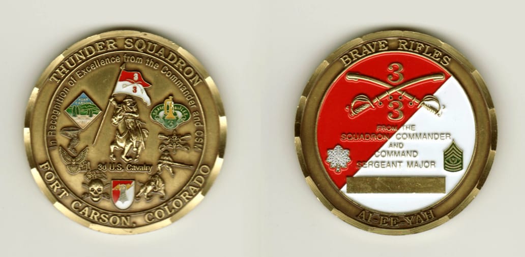 Round shaped, brass colored coin, 2 inches in diameter.