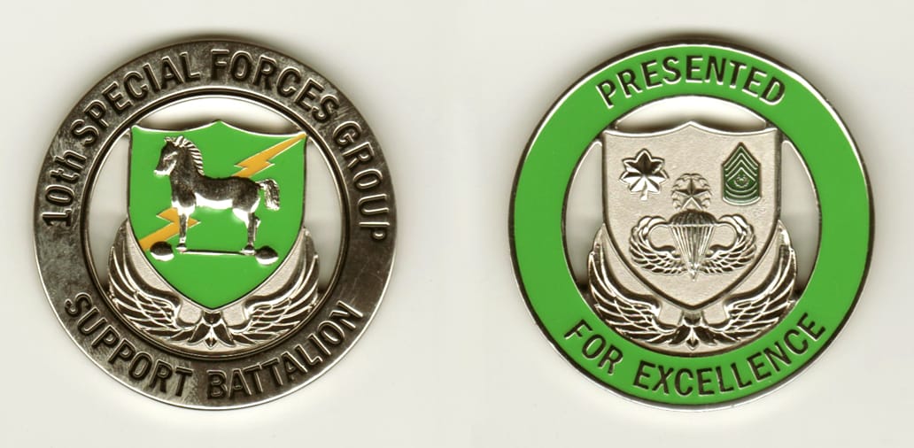 Round shaped, silver colored coin, 2 inches in diameter.