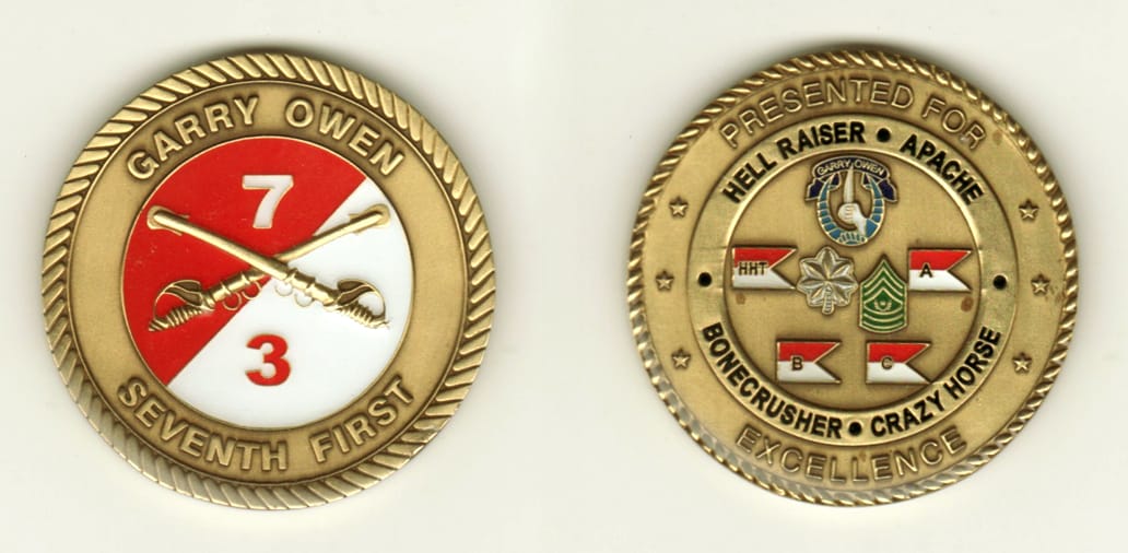 Round shaped, brass colored coin, 2 inches in diameter.