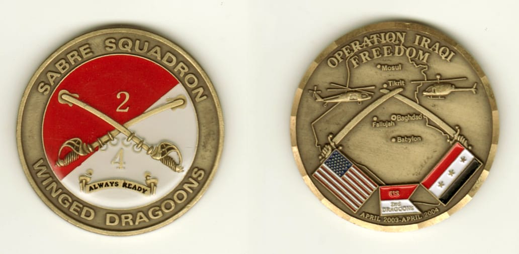 Round shaped, brass colored coin, 2 inches in diameter.