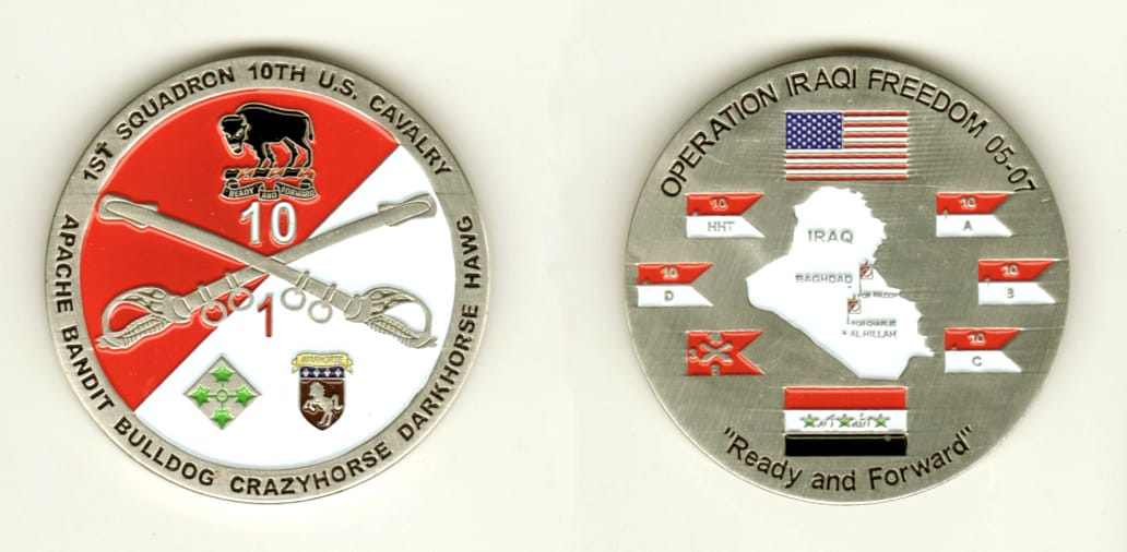 Round shaped, pewter colored coin, 2 inches in diameter.