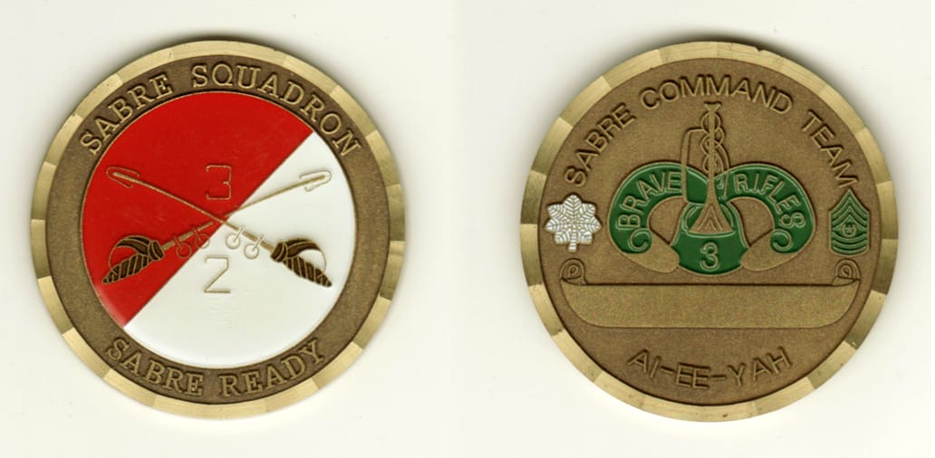 Round shaped, brass colored coin, 2 inches in diameter.