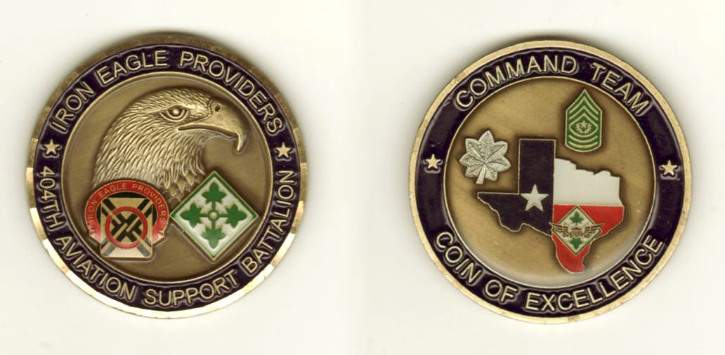 Round shaped, brass colored coin, 2 inches in diameter.