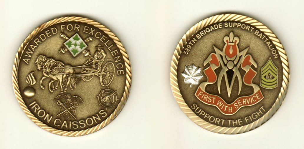 Round shaped, brass colored coin, 2 inches in diameter.