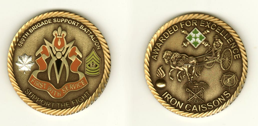 Round shaped, brass colored coin, 2 inches in diameter.