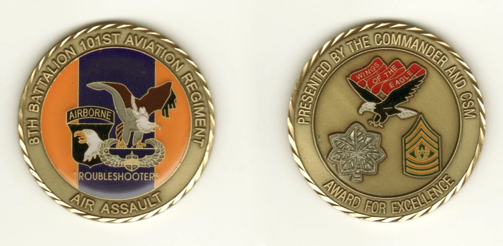 Round shaped, brass colored coin, 2 inches in diameter.