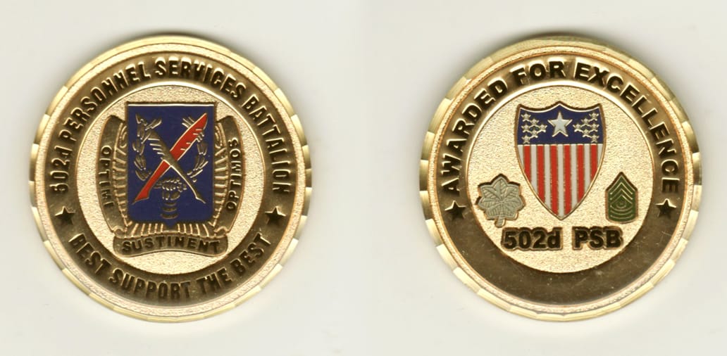 Round shaped, gold colored coin, 2 inches in diameter.