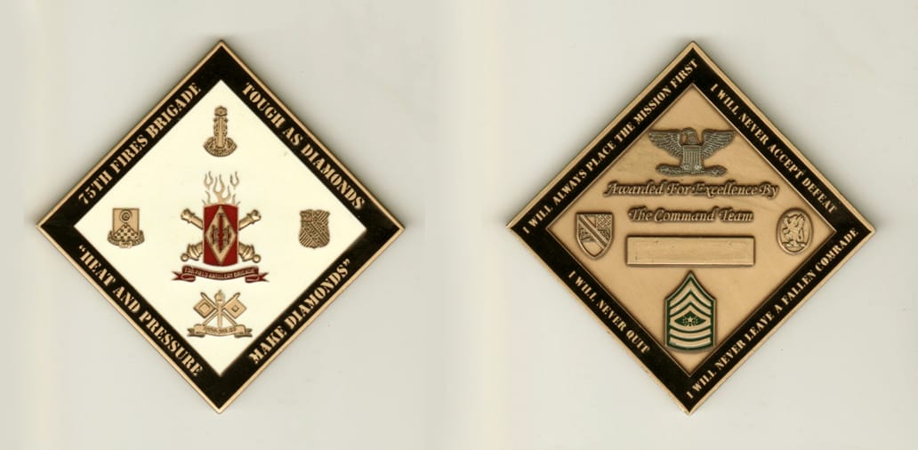 Diamond shaped, brass colored coin, 2-3/4 inches wide  by 2-3/4 inches high.