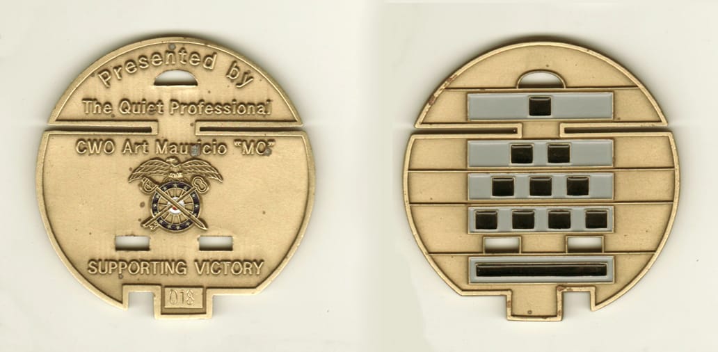 Round shaped, brass colored coin, 2-1/2 inches in diameter.