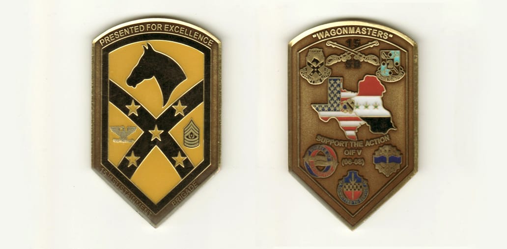 Shield shaped, brass colored coin with rounded top and pointed bottom, 1-5/8 inches wide x 2-1/2 inches high.