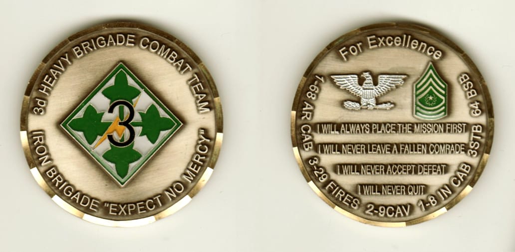 Round shaped, brass colored coin, 2 inches in diameter.