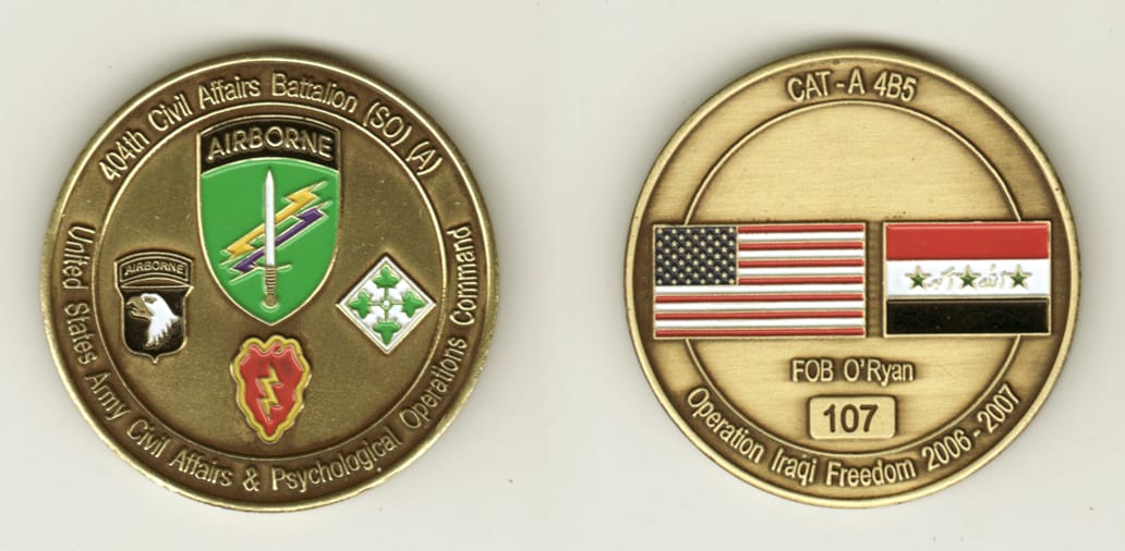 Round shaped, antique brass colored coin, 2 inches in diameter.