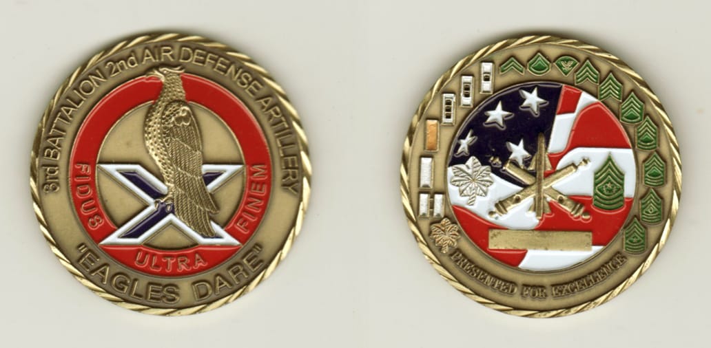 Round shaped, antique brass colored coin, 2 inches in diameter.