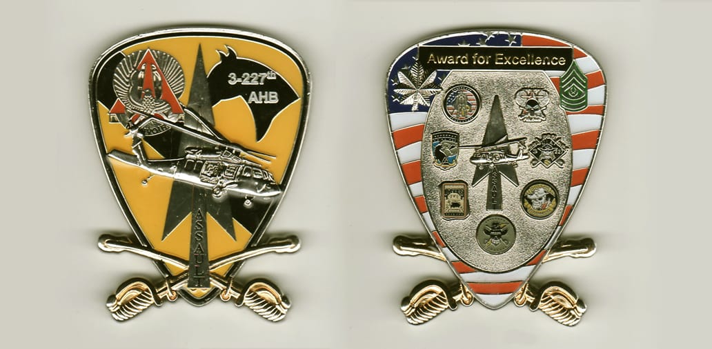 Shield shaped, silver colored coin, with cross sabers mounted across bottom and extended,  2-3/4 inches high x 2 inches ...