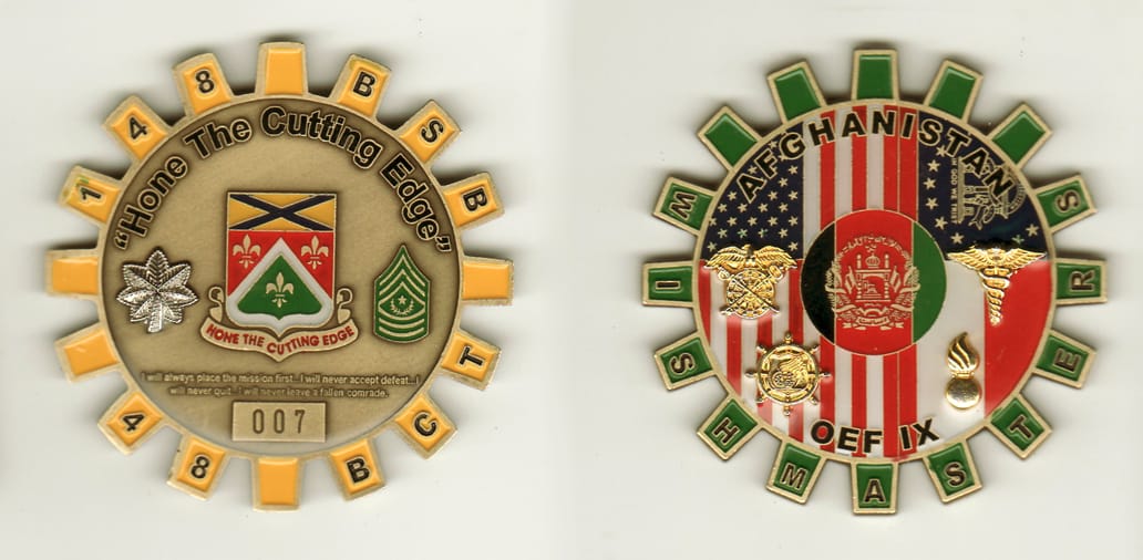 Round cog shaped, brass colored coin, 2-1/2 inches in diameter.