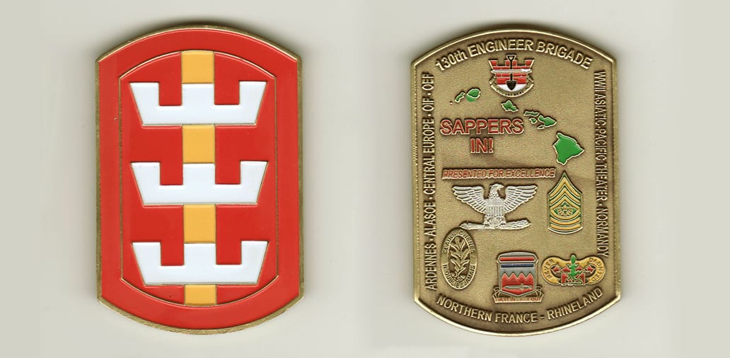 Retangular shaped with bowed top and bottom, brass colored coin, 1-3/4 inches wide x 2-1/2 inches high.