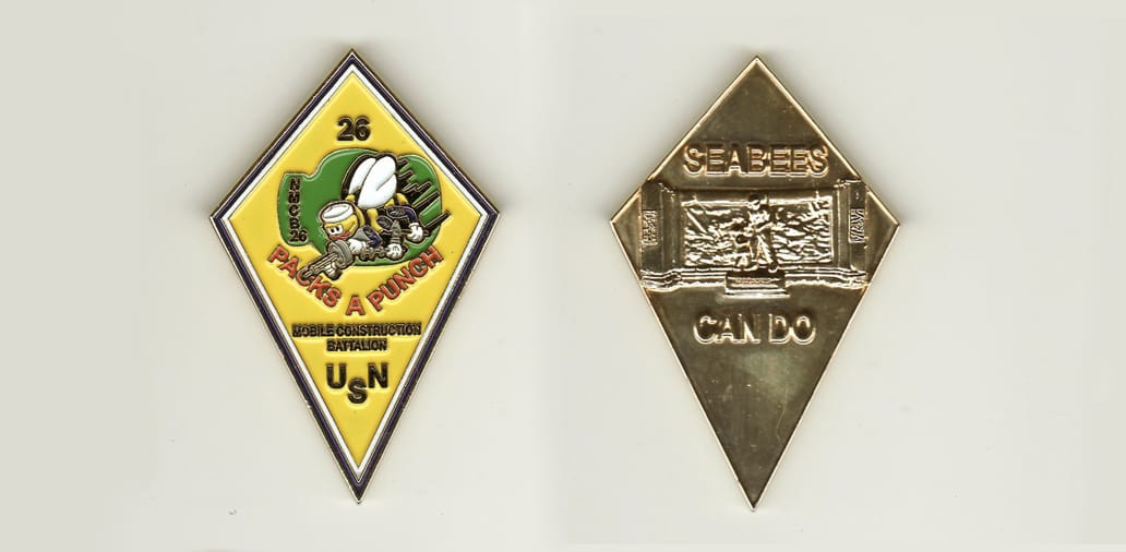 Diamond shaped, brass colored coin, 1-3/4 inches wide x 2-1/2 inches high.