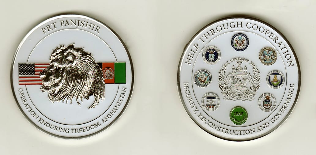 Round shaped, silver colored coin, 2-1/4 inches in diameter.